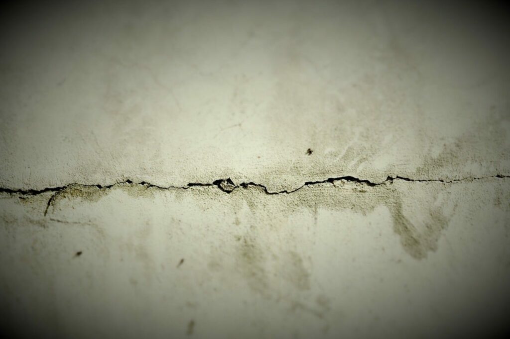 Cracks on concrete floor | All American Flooring