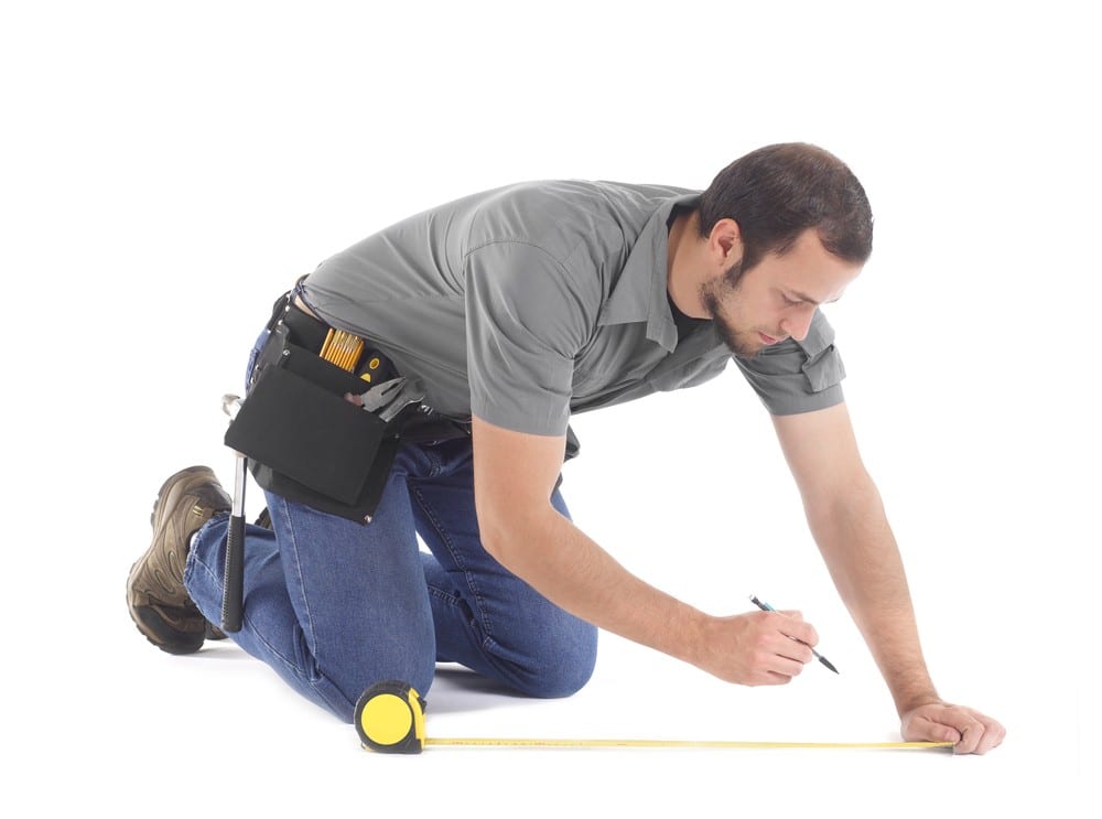 Man measuring | All American Flooring