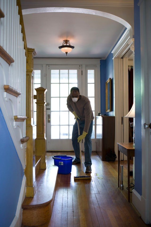 Man tile cleaning | All American Flooring