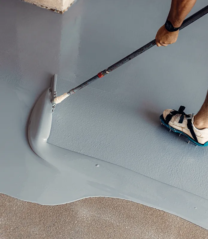 Applying epoxy resin to floor | All American Flooring