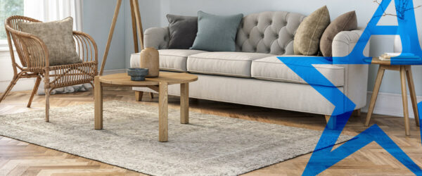 a living room with a couch a chair and a table | All American Flooring